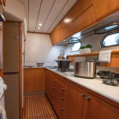 Aegean Gateaways anchored near beautiful Greek island coastline