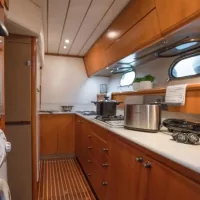 Aegean Getaways anchored near beautiful Greek island coastline